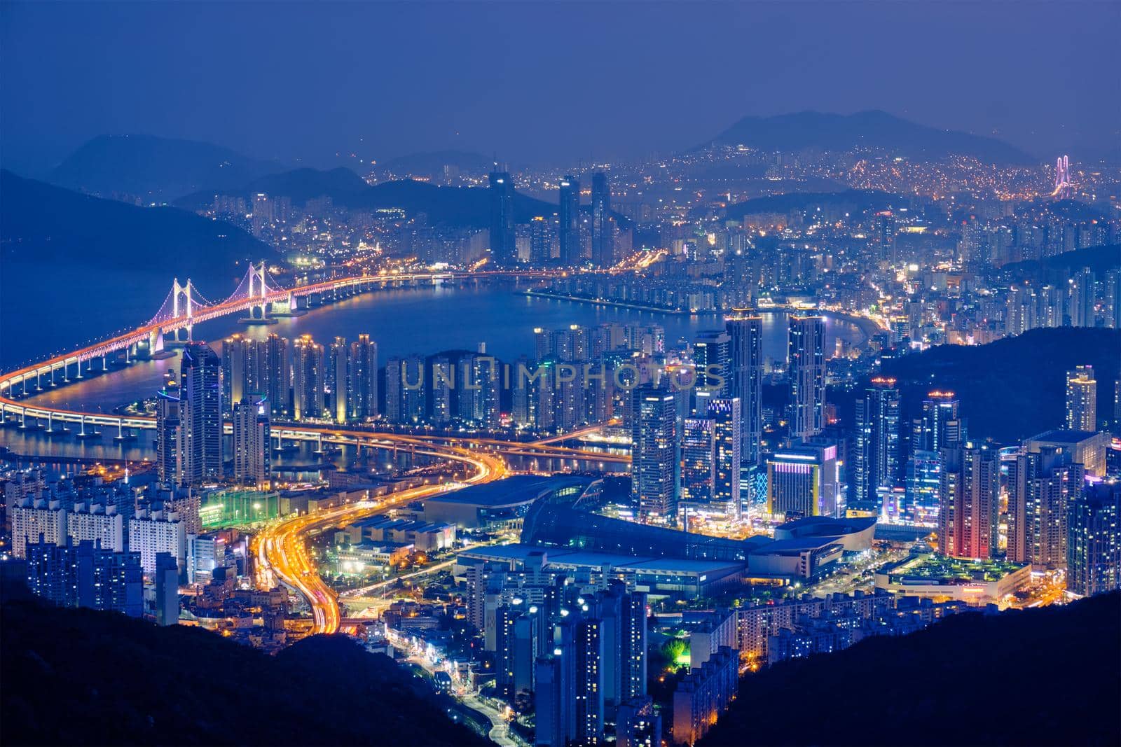 Busan cityscape with skyscrapers and Gwangan Bridge illuminated at night. Busan. South Korea