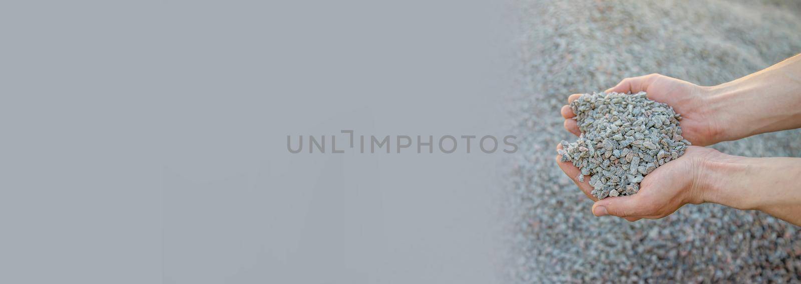 Man holding small rubble in his hands