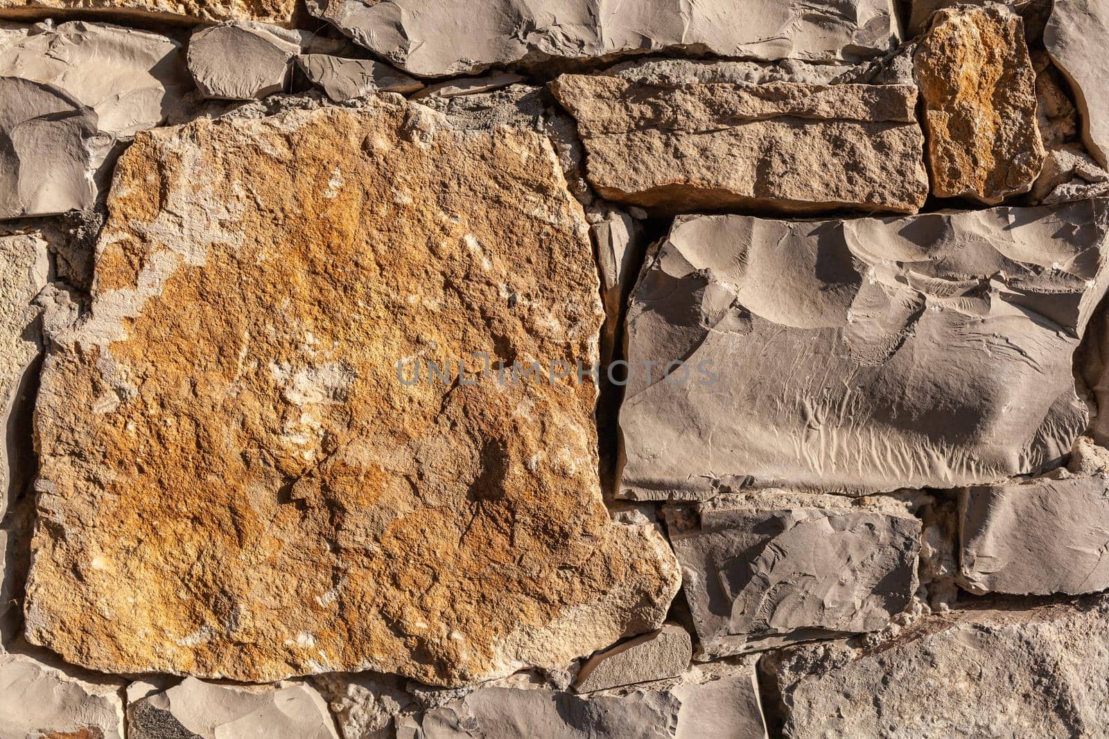 Texture of a stone wall. Old castle stone wall texture background.  by AnatoliiFoto