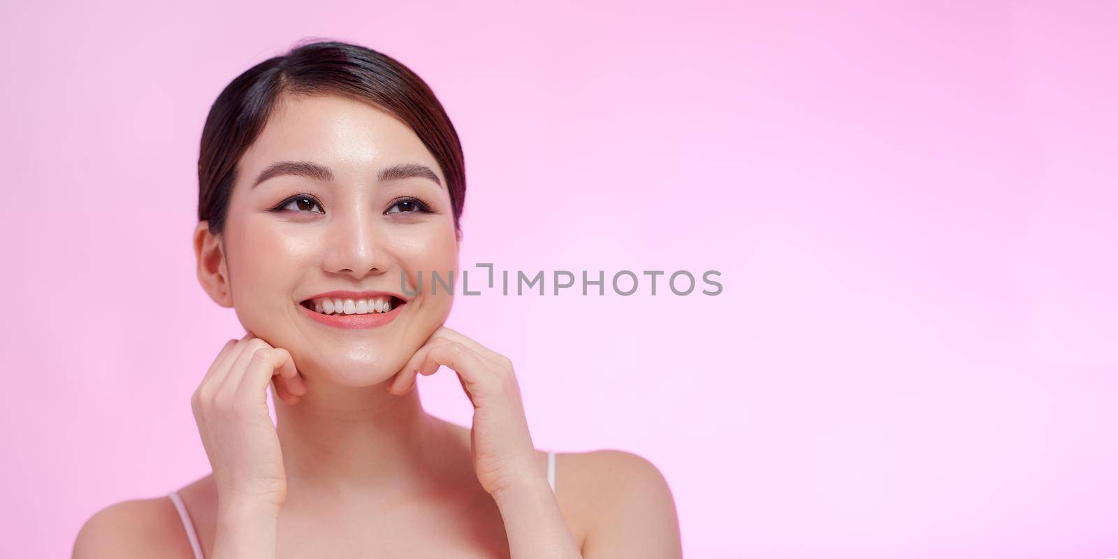Beautiful young woman with clean fresh skin  by makidotvn