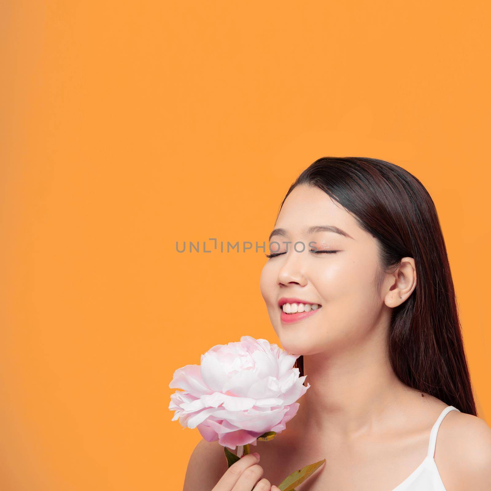 girl holding flower peony wearing white clothes