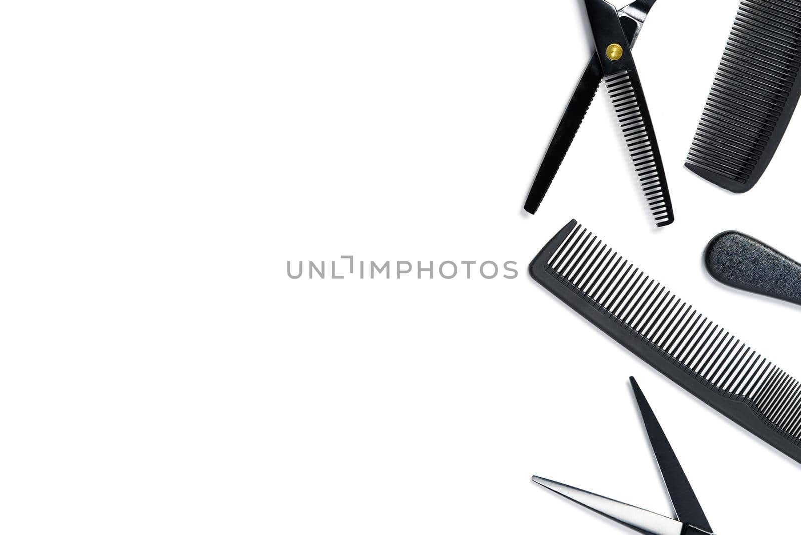 layout on white from scissors and combs for hairdressing services by PhotoTime