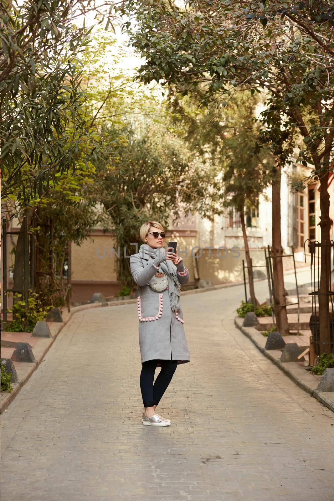 Pretty blonde taking a selfie on a spring day.