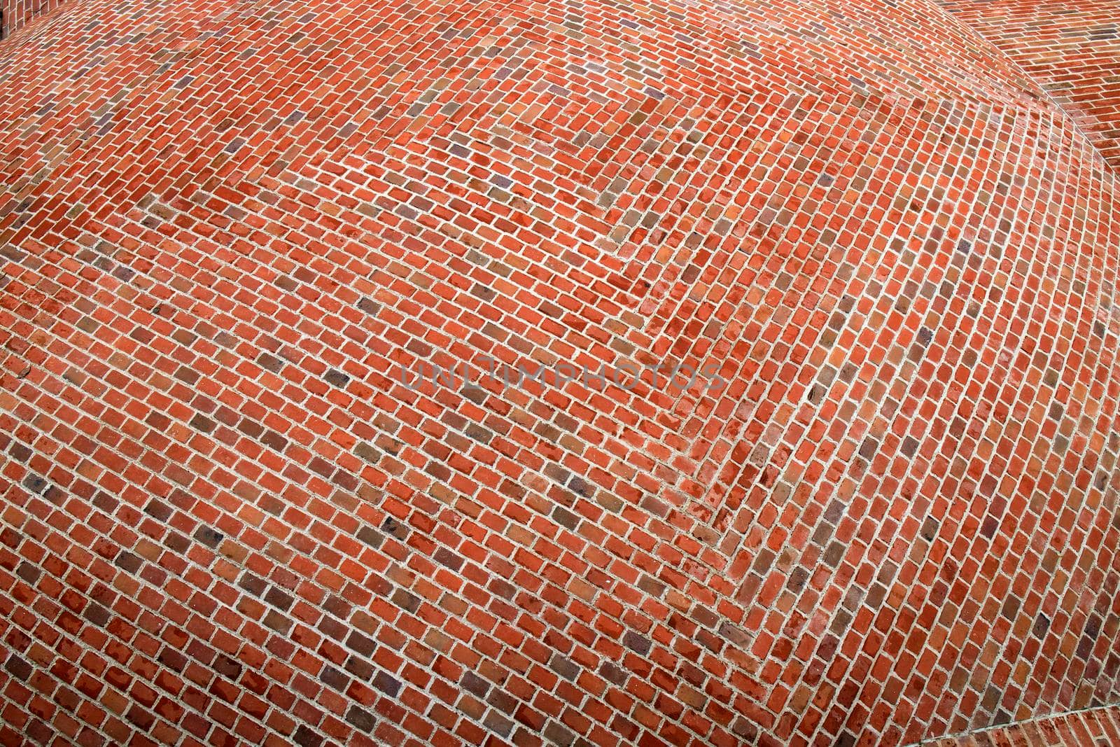 Fragment of the surface of a spherical red brick roof