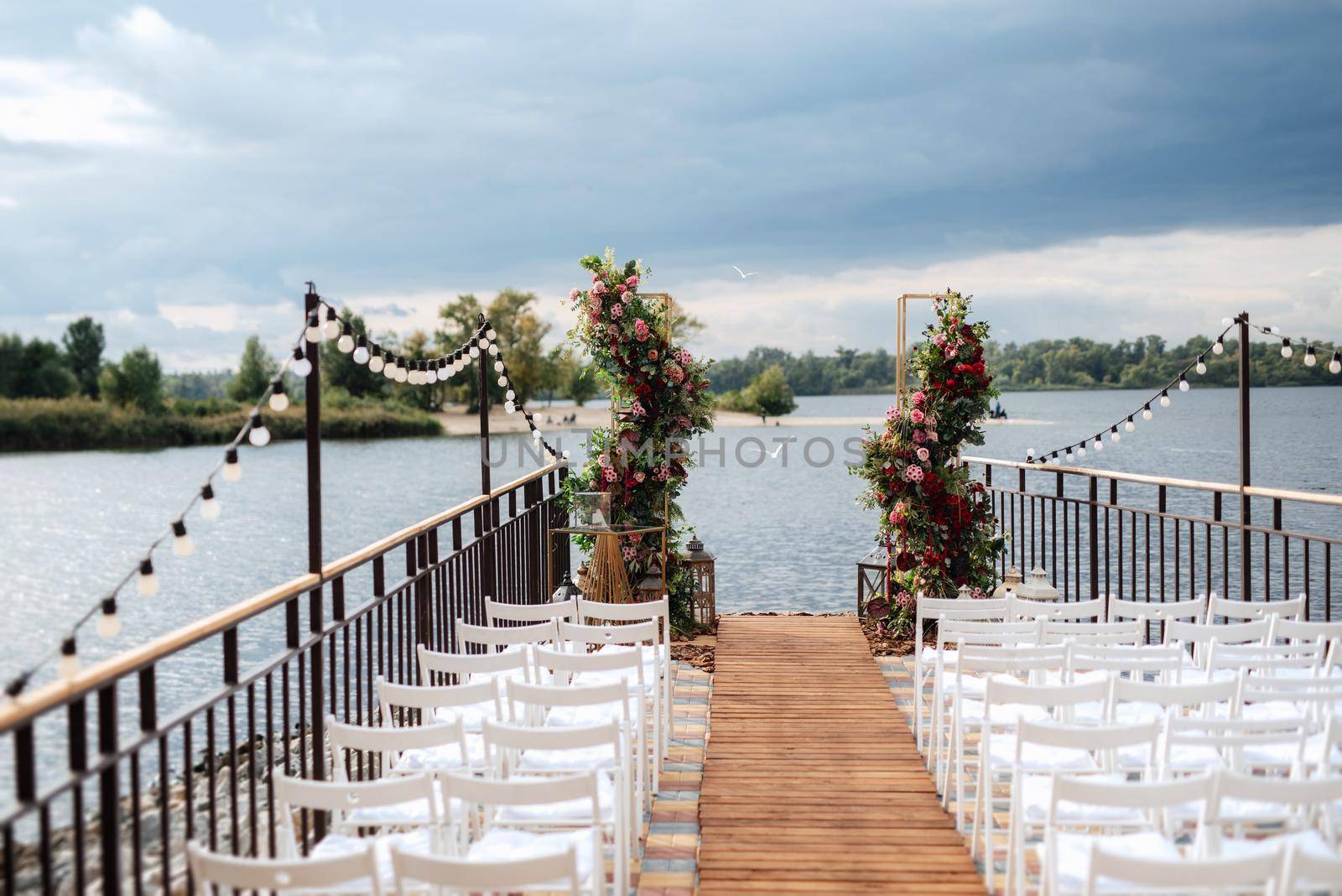 wedding ceremony area, arch chairs decor