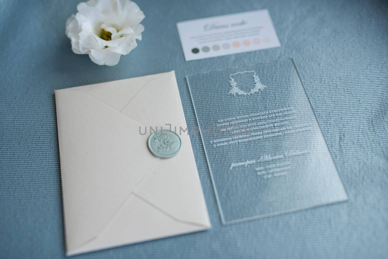 wedding invitation in a gray envelope on a table by Andreua