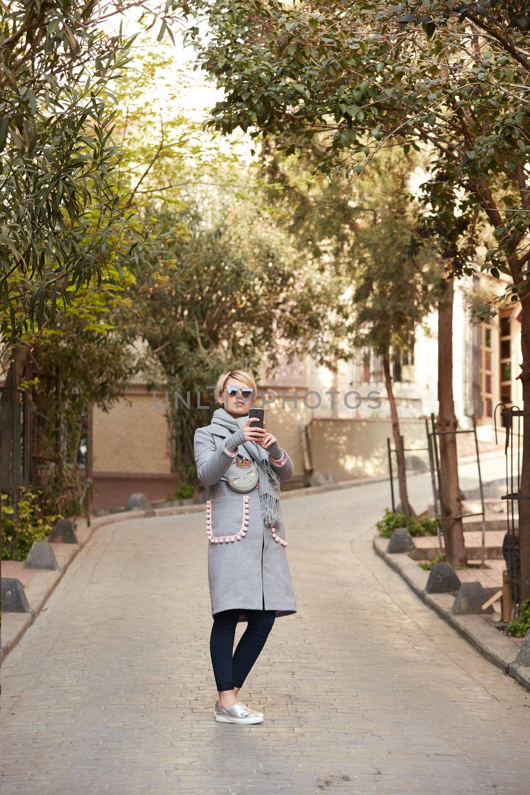 Pretty blonde taking a selfie on a spring day.