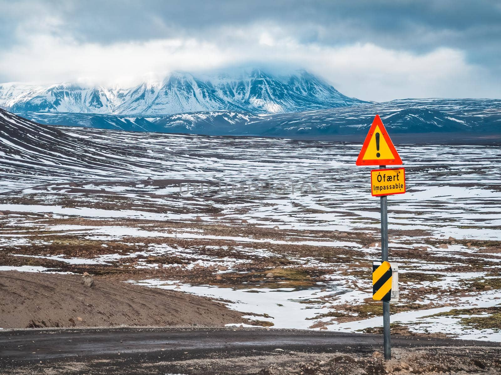 Remote road to highlands with danger impassable signals in Iceland