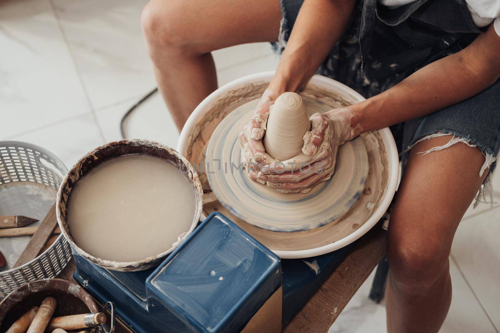 Process of Creating Clay Pot, Unrecognisable Female Master Working on Pottery Wheel in Studio