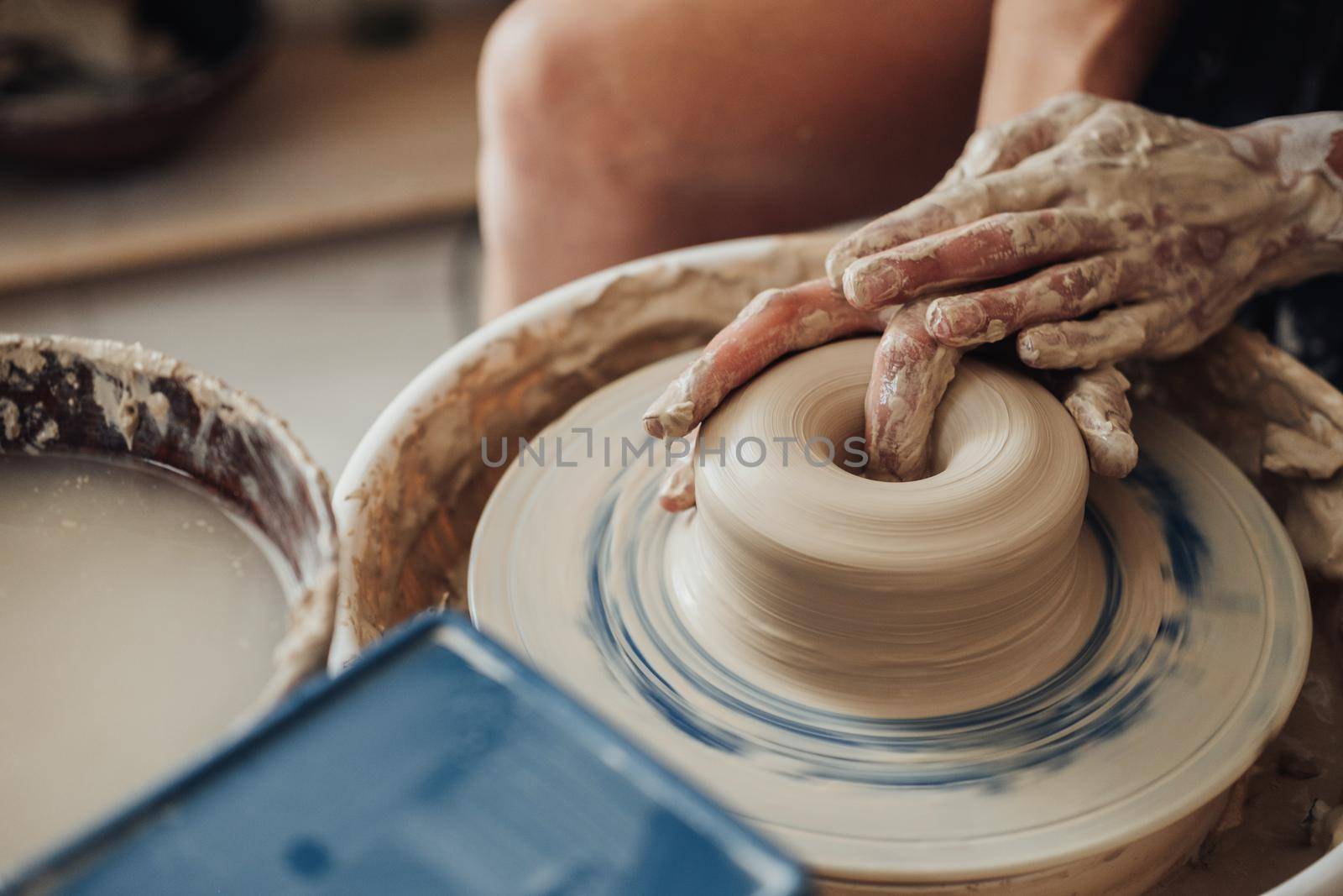 Close Up of Potter Master at Work in Clay Studio, Handmade Process on a Pottery Wheel by Romvy