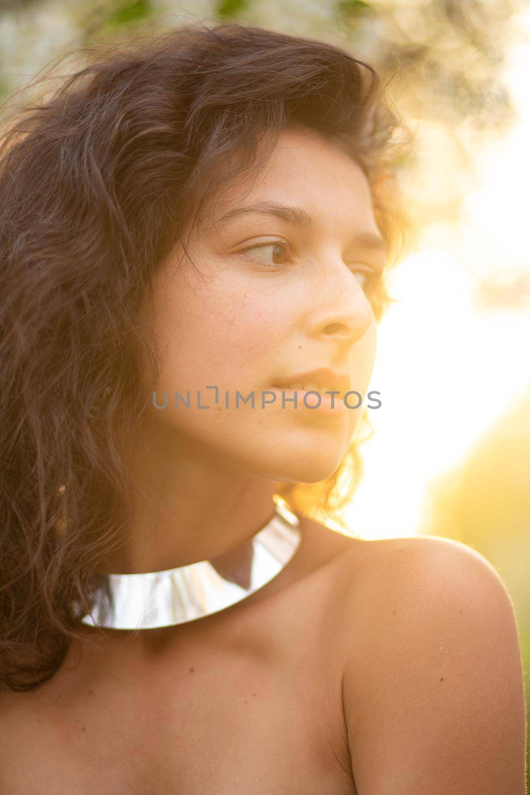 Portrait of a young sexy brunette girl with a necklace around her neck by Try_my_best