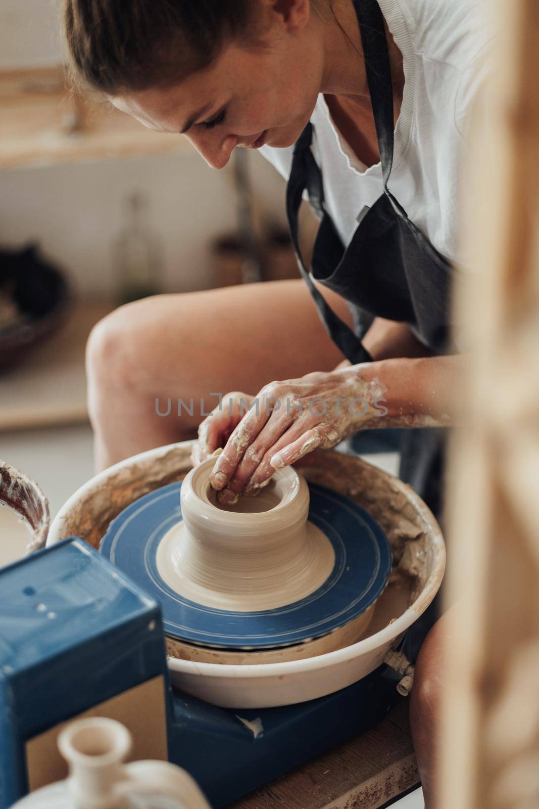 Female Pottery Master at Work in Her Clay Studio, Young Entrepreneur Woman Happy Owner of a Small Business by Romvy