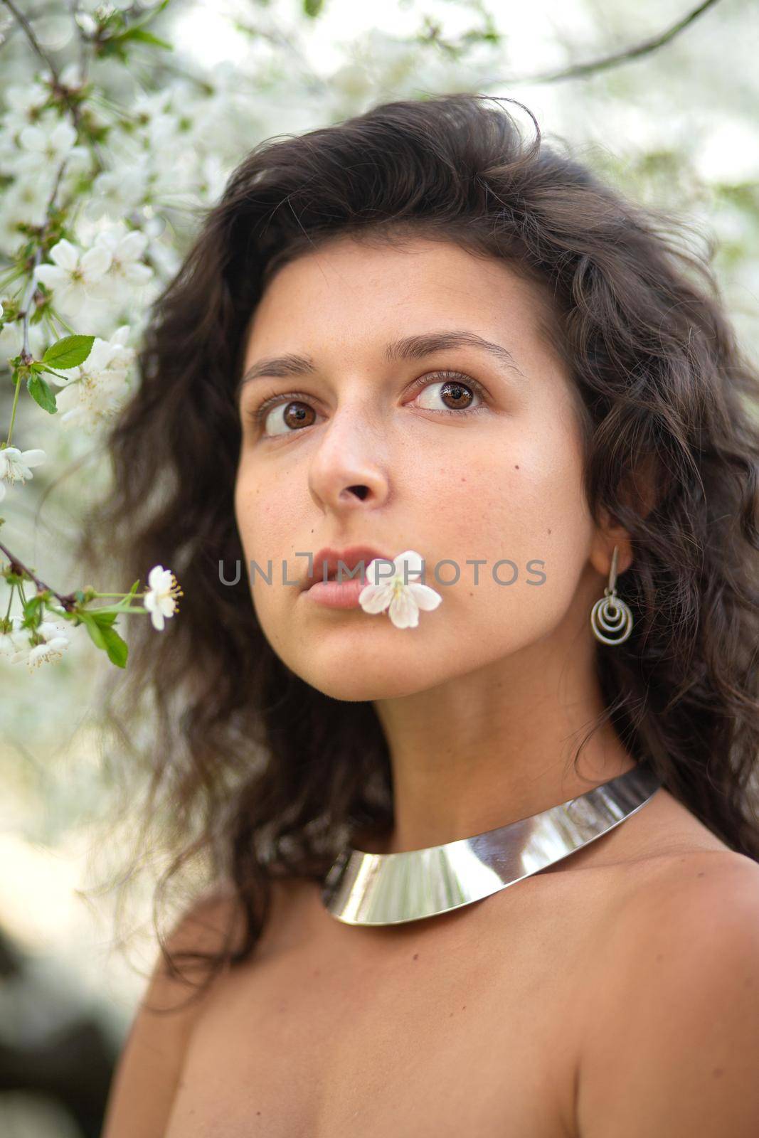 Portrait of a young laughing sexy brunette girl with a necklace around her neck by Try_my_best