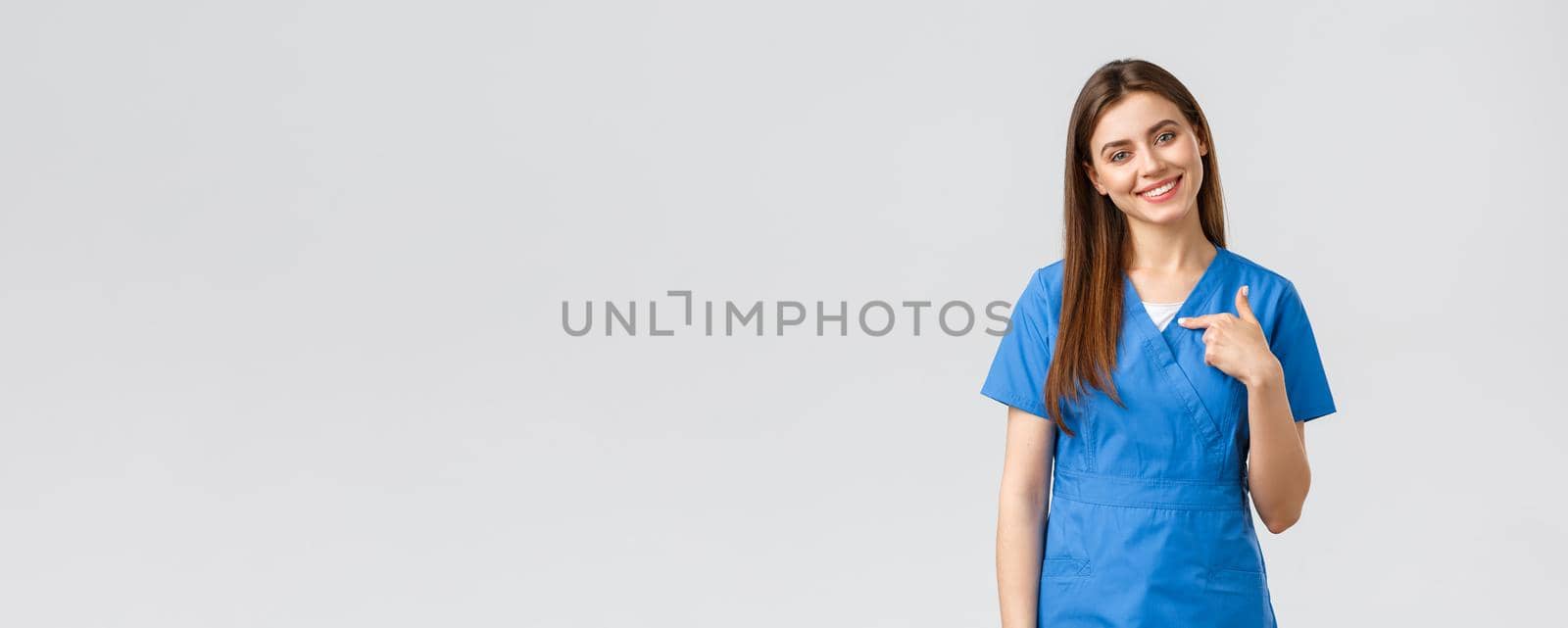 Healthcare workers, prevent virus, insurance and medicine concept. Pleasant smiling pretty nurse, female doctor in blue scrubs, pointing herself, ready help, saving patients by Benzoix