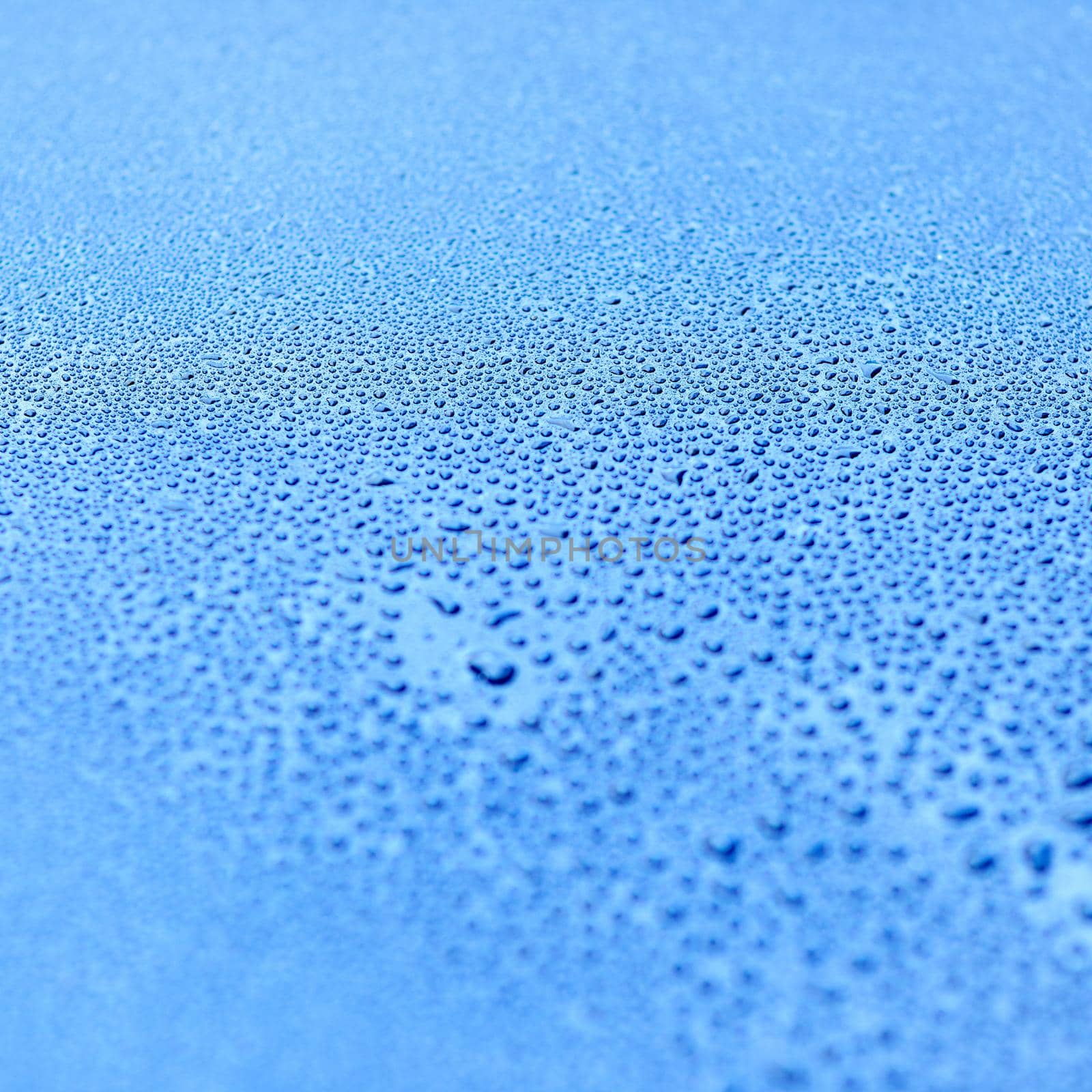 Shot of drops of water on a smooth surface.
