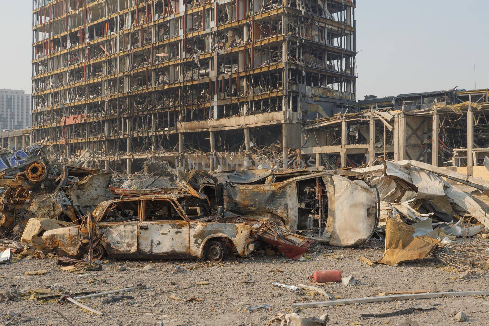 Aftermath shell of civilian bombed city damage car. 2022 Russian invasion of Ukraine war torn city destroyed car burn out. Bomb attack Russia war damage Ukraine city war destruction Russian aggression by synel