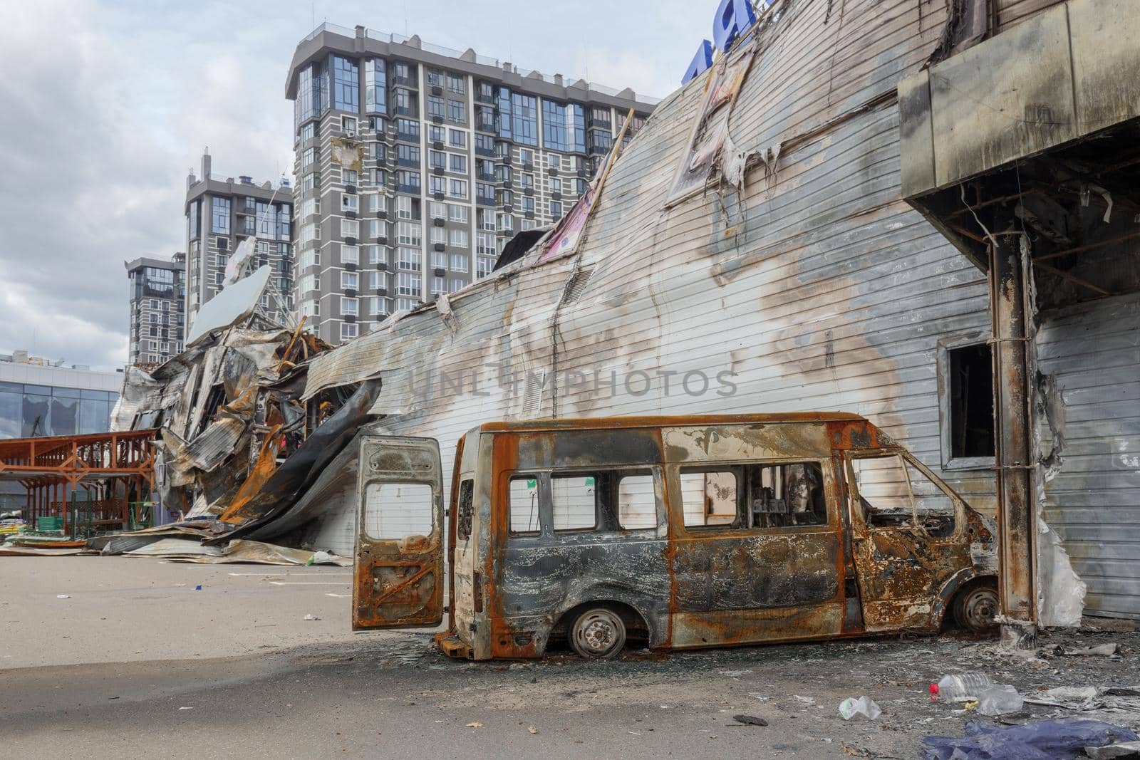 2022 Russian invasion of Ukraine Bucha war torn city destroyed car burn out. Aftermath shell of civilian bombed city Bucha damage building destruction. Bomb attack Russia war damage Ukraine war crime