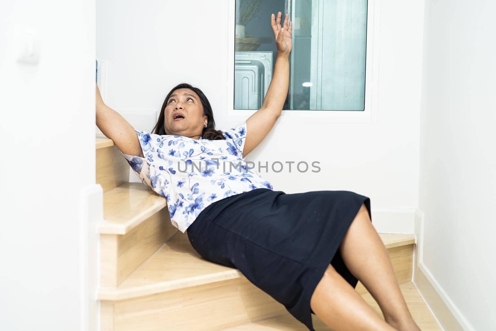 Asian middle-aged lady woman patient fall down the stairs because slippery surfaces