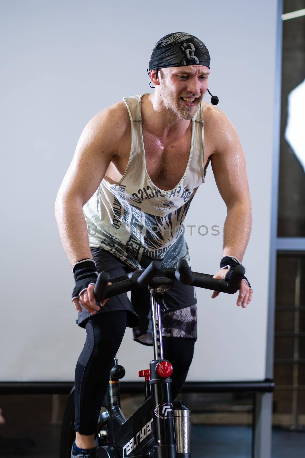 RUSSIA, MOSCOW - APR 09, 2022: bike bicycle bearded legs lifestyle healthy young feet, In the afternoon exercise body from weight from bodybuilding sporty, background cardio. Pedal