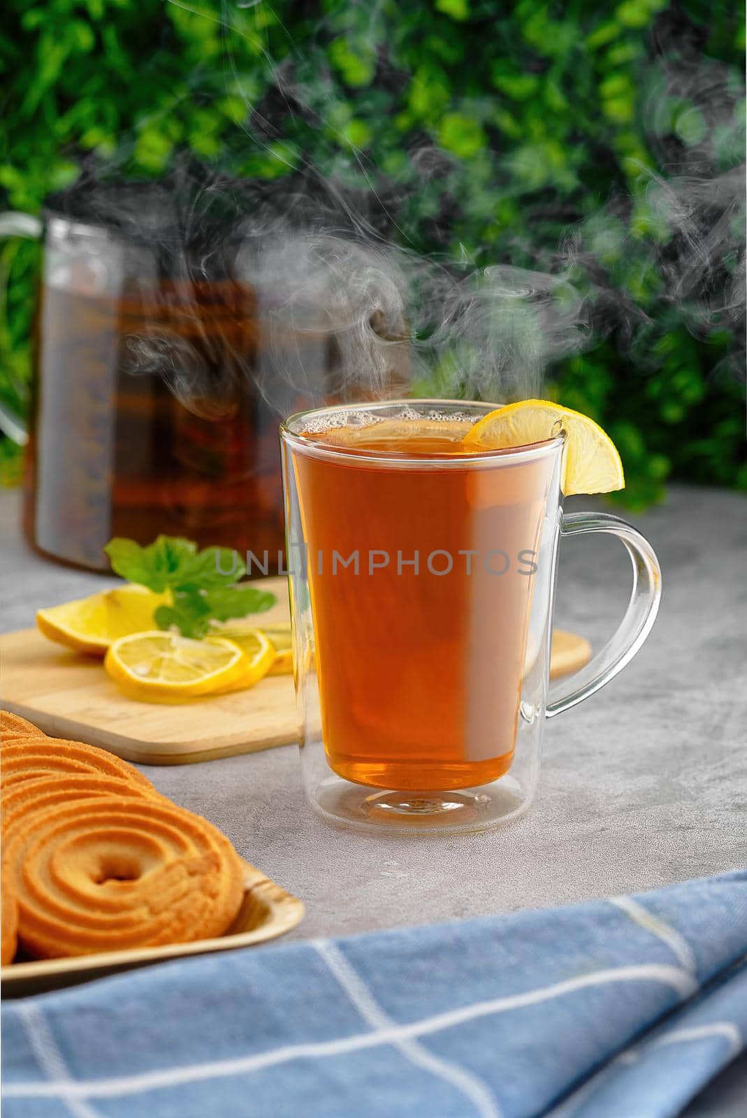 Tea hot drink with steam on old background in composition on the table by PhotoTime