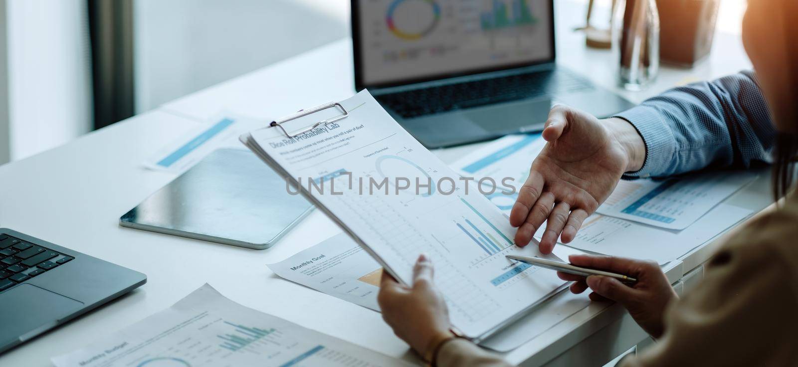 Business People Analyzing Statistics Business Documents, Financial Concept by nateemee