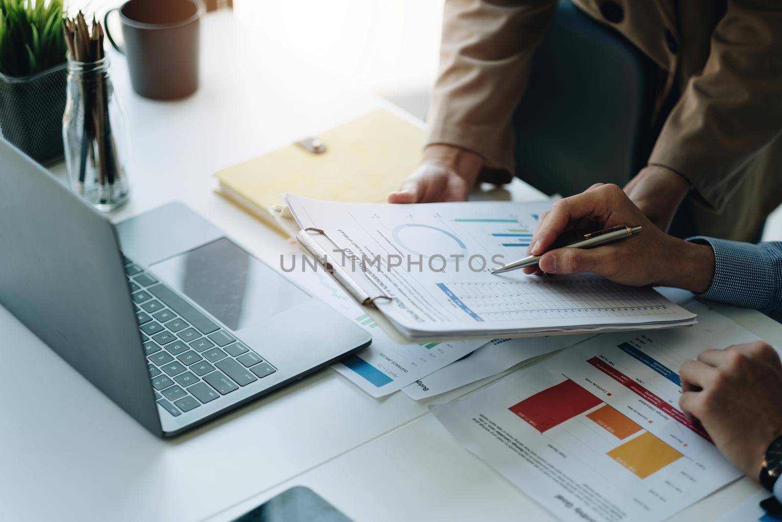 Business People Meeting to analyse and discuss and brainstorming the financial report chart data in office Financial advisor teamwork and accounting close up concept