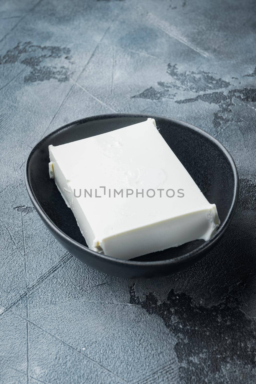 Raw organic white feta cheese set, on gray background with copy space for text