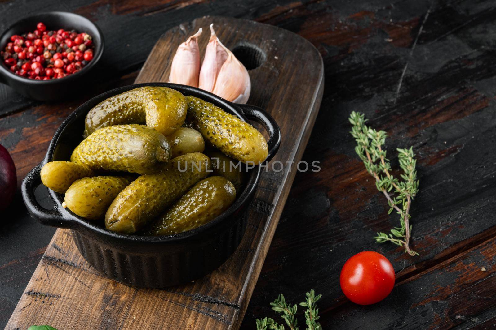 Bavarian gherkins, on old dark wooden table background by Ilianesolenyi