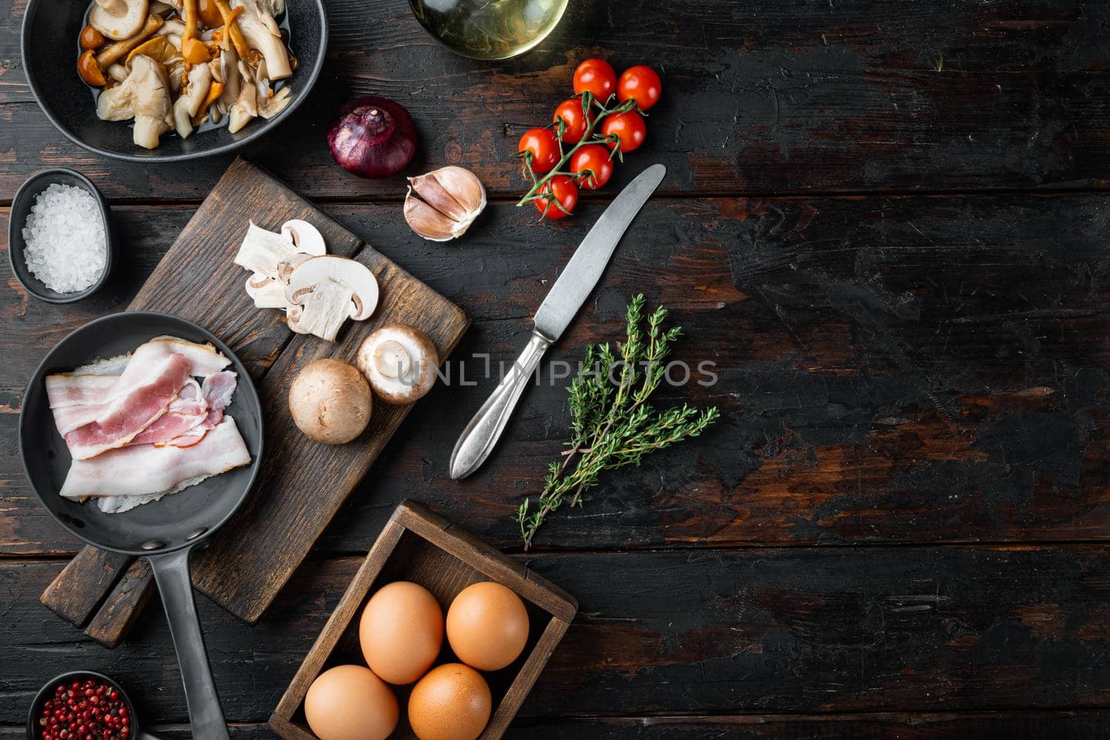 Healthy breakfast ingredients for fried eggs, on old dark wooden table background, top view flat lay , with space for text copyspace by Ilianesolenyi