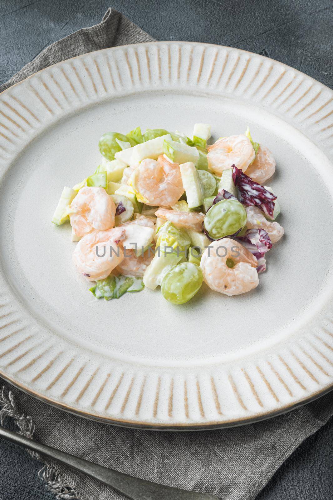 Prawn cocktail with lettuce, cherry tomatoes, dressing, dill , with sauce apple and grape, on gray background by Ilianesolenyi