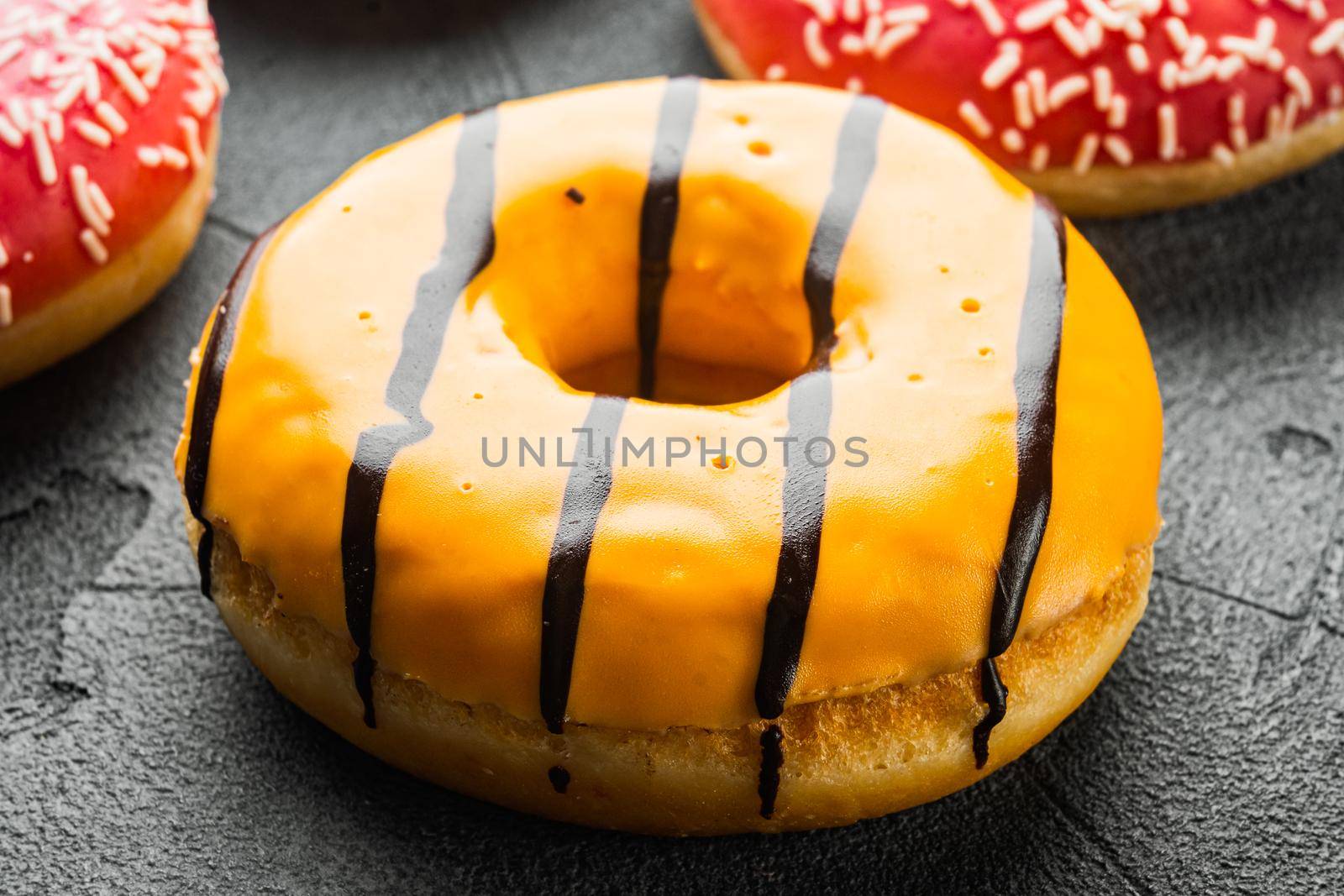 Orange fresh Donut, on gray background by Ilianesolenyi