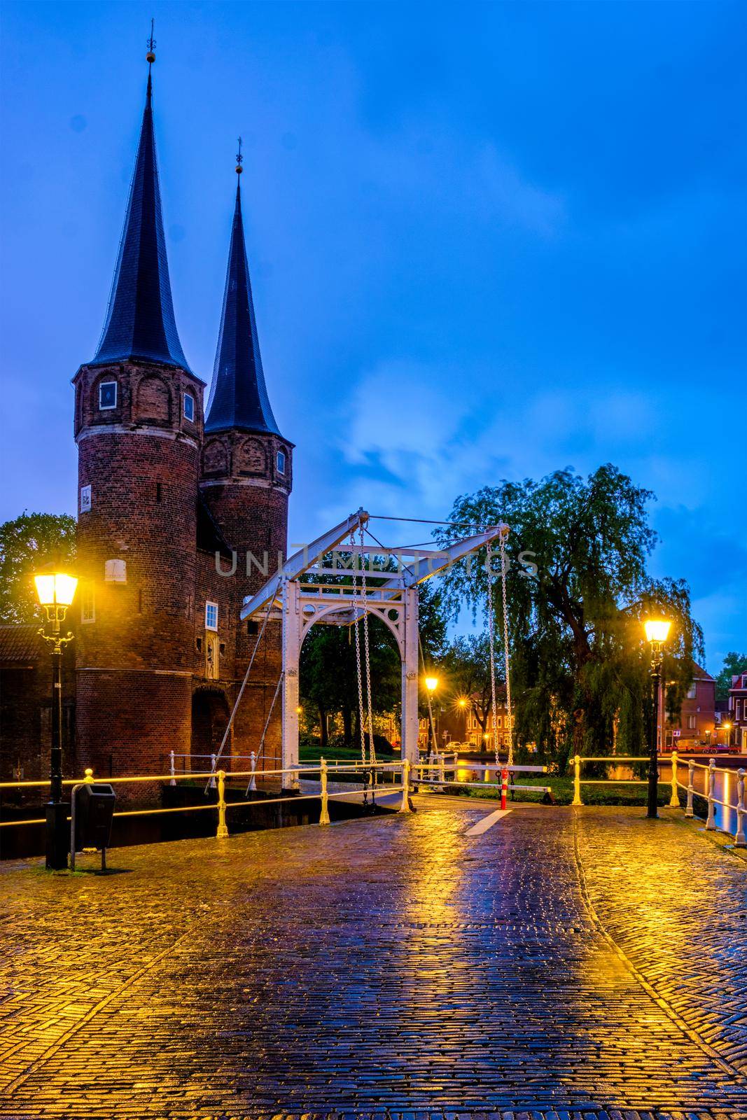 Oostport (Eastern Gate) of Delft with drawbridge in twilight. Delft, Netherlands