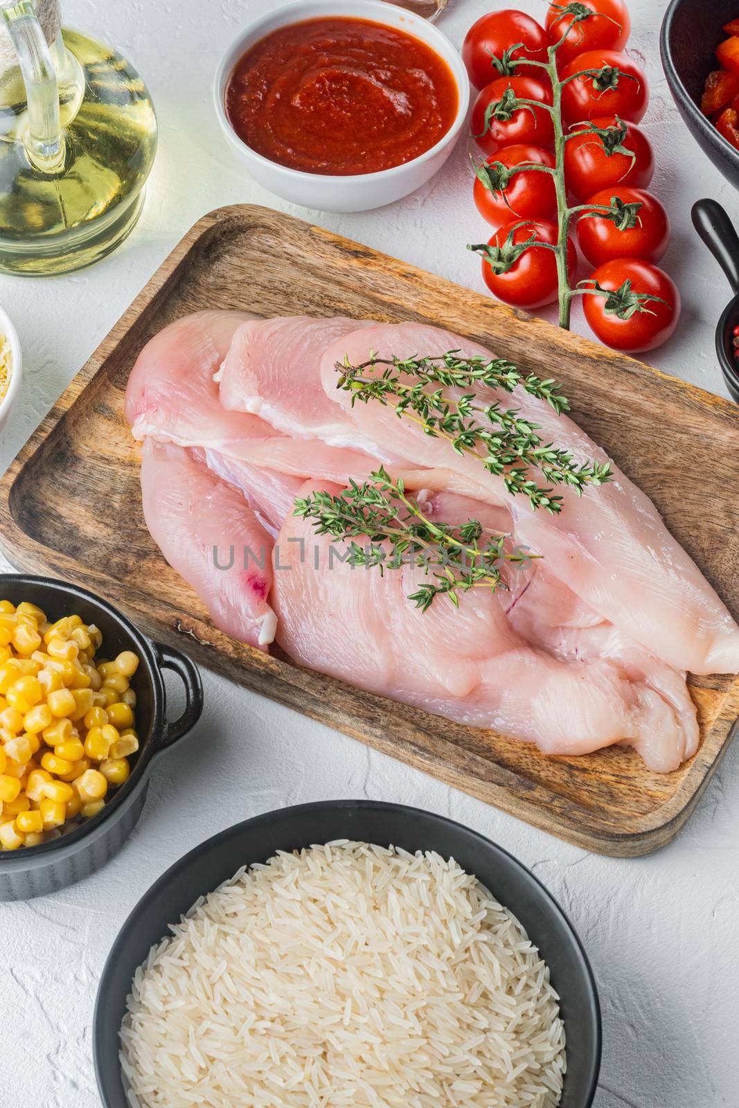 Chicken Enchilada ingredients Rice, mozzarella, corn, on white background