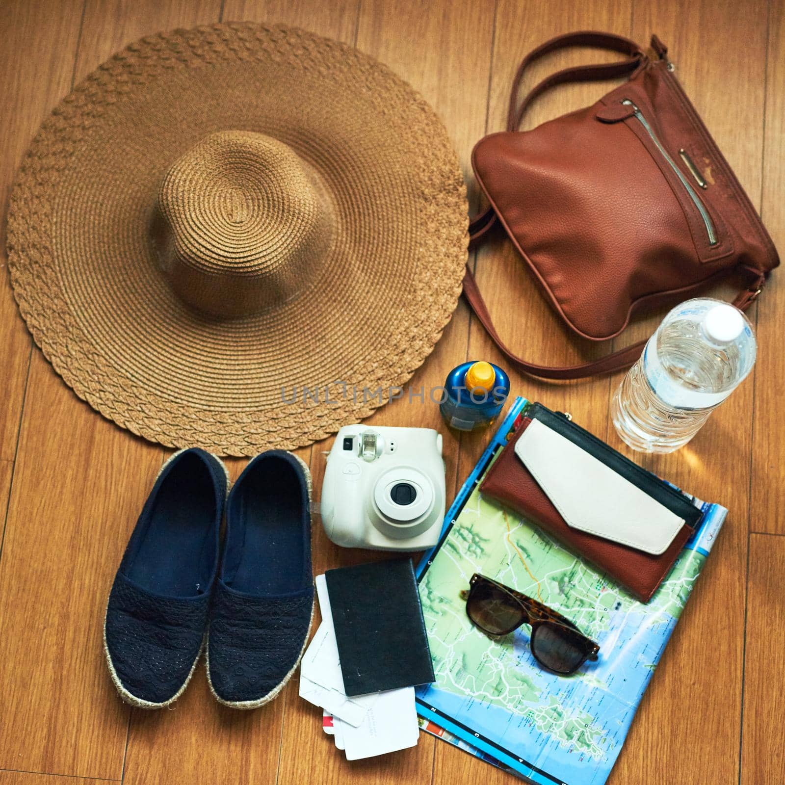 The tourists essentials. High angle shot of travelling essentials on a table. by YuriArcurs