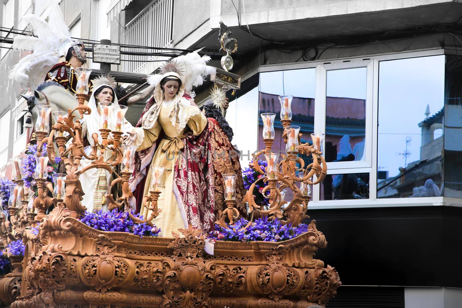 Elche, Spain- April 13, 2022: Easter Parade with bearers and penitents through the streets of Elche city in the Holy Week