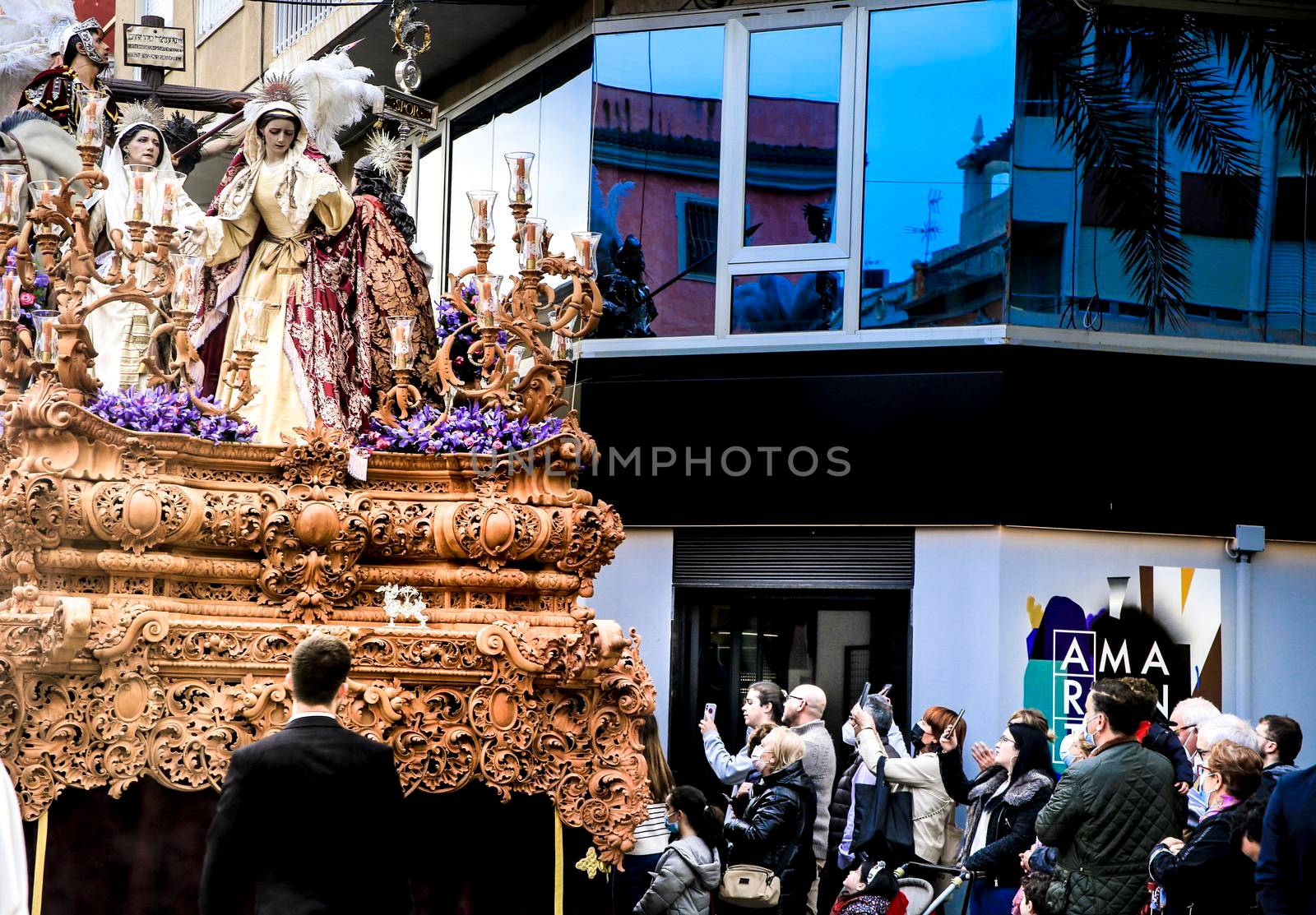 Elche, Spain- April 13, 2022: Easter Parade with bearers and penitents through the streets of Elche city in the Holy Week