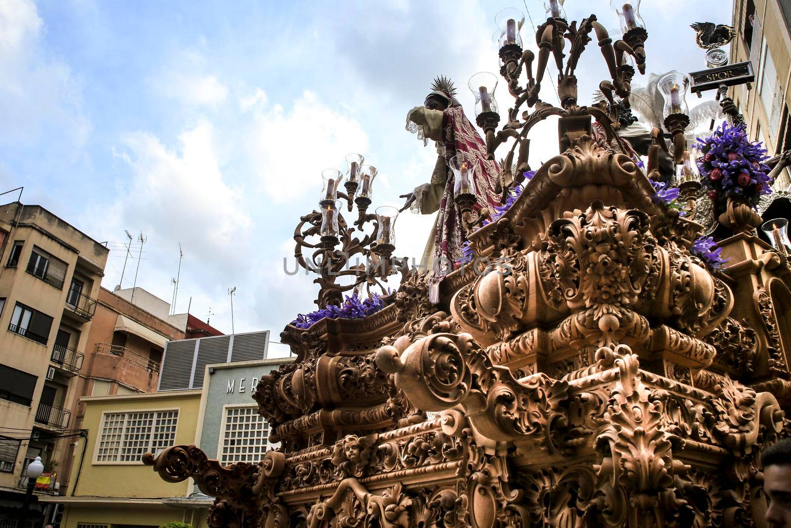 Elche, Spain- April 13, 2022: Easter Parade with bearers and penitents through the streets of Elche city in the Holy Week