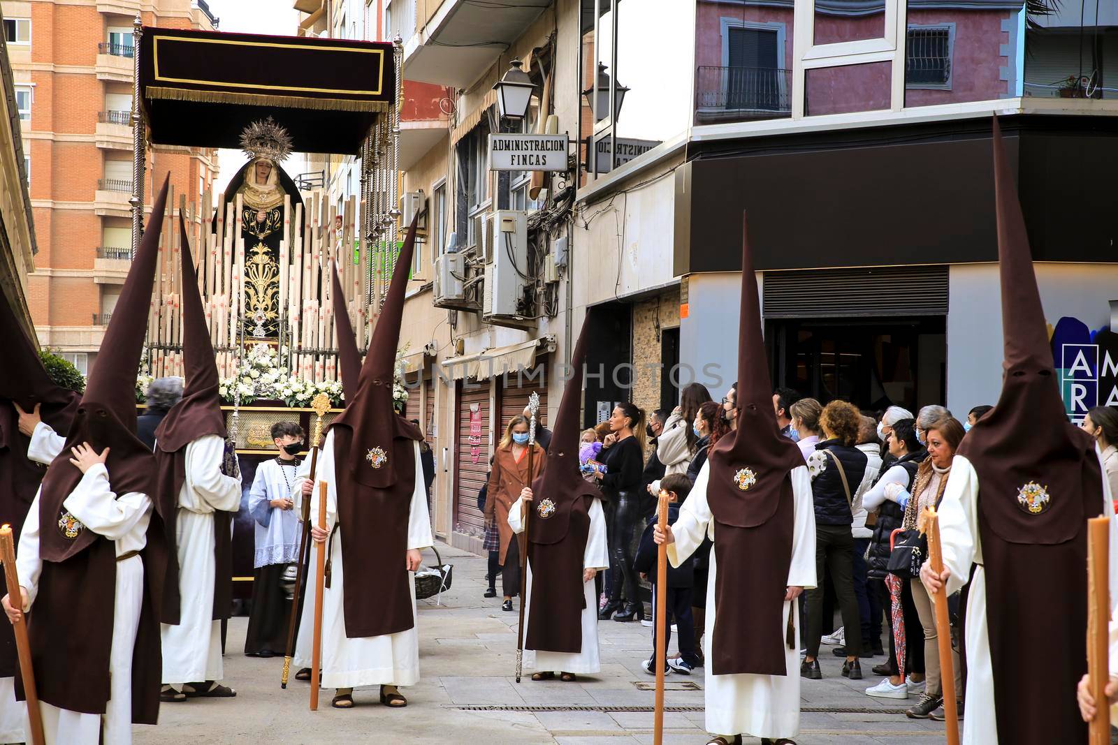 Elche, Spain- April 13, 2022: Virgin Mary on Easter Parade with bearers and penitents through the streets of Elche city in the Holy Week