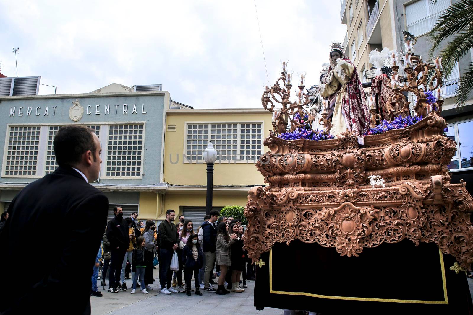 Elche, Spain- April 13, 2022: Easter Parade with bearers and penitents through the streets of Elche city in the Holy Week