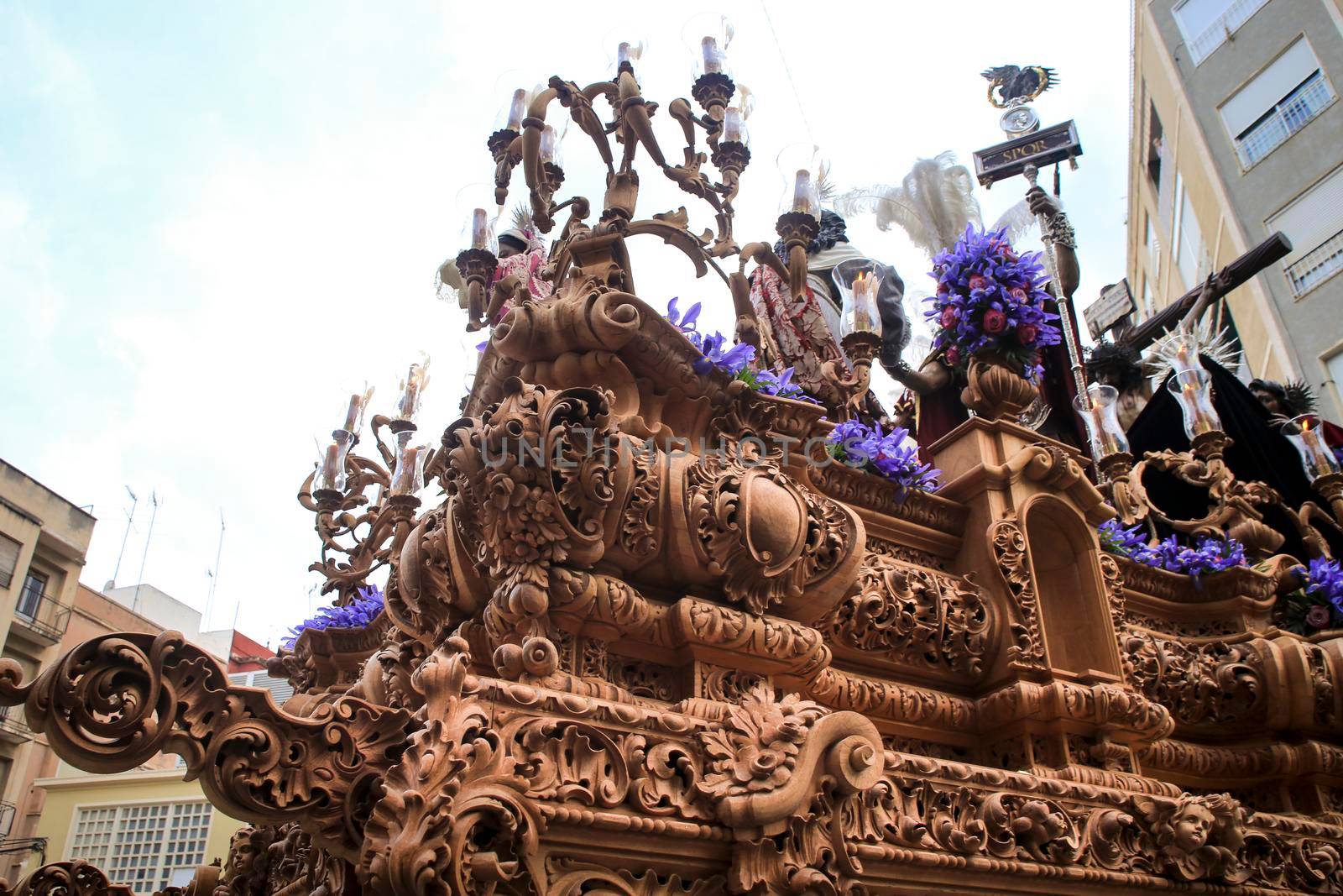 Elche, Spain- April 13, 2022: Easter Parade with bearers and penitents through the streets of Elche city in the Holy Week