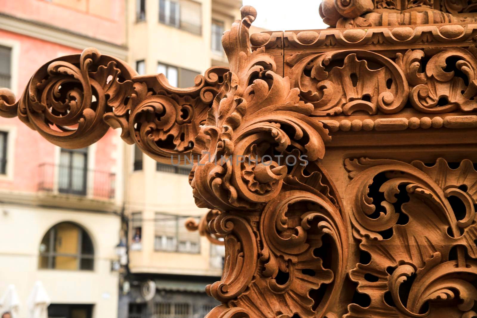 Elche, Spain- April 13, 2022: Beautiful wooden details of Easter Parade with bearers and penitents through the streets of Elche city in the Holy Week