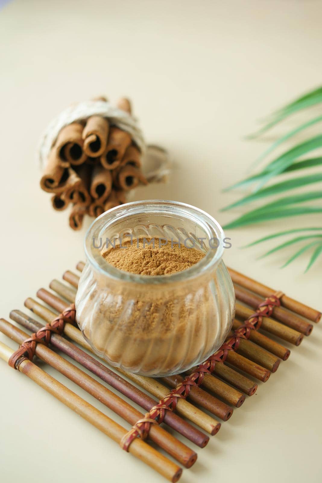 Cinnamon sticks and cinnamon powder on white background