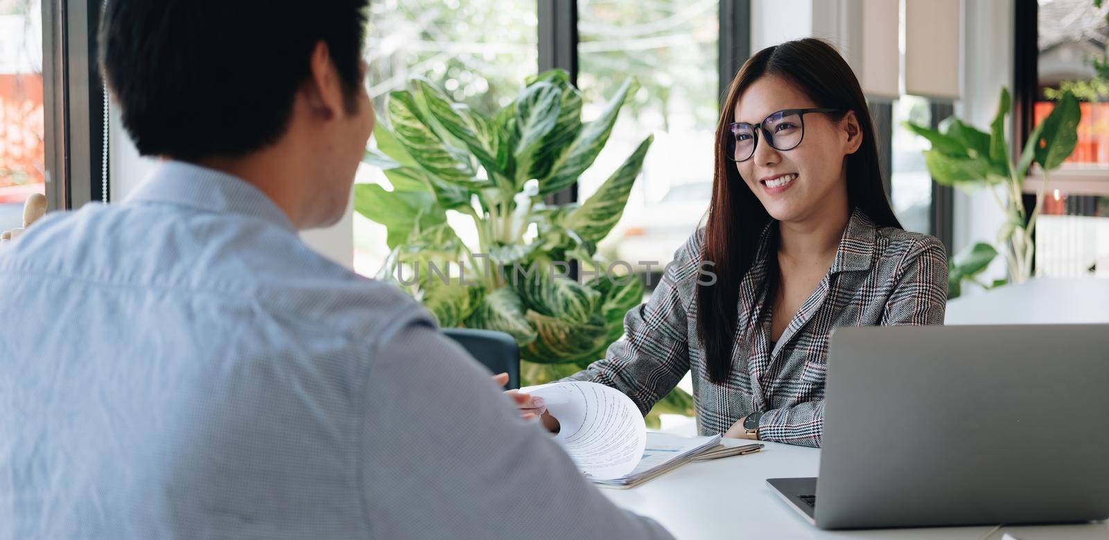 Employer or recruiter reading a resume during about colloquy his profile of candidate, employer conducting a job interview, manager resource employment and recruitment concept. by nateemee