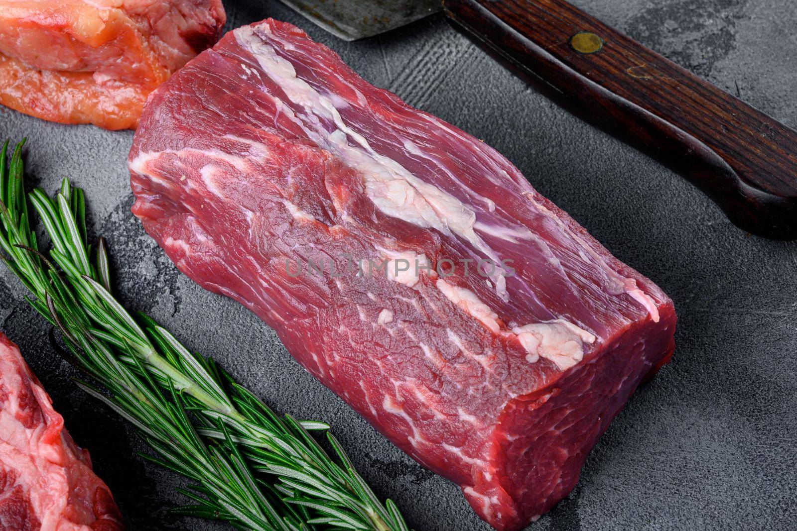 Fresh and raw fillet meat. Whole piece of beef tenderloin steaks set, on gray stone background