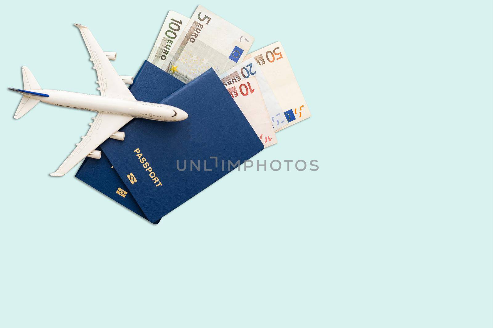 Hat, toy airplane, passport, money.