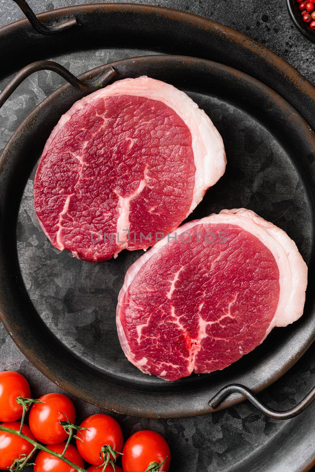 Raw beef meat cut set, on black dark stone table background, top view flat lay