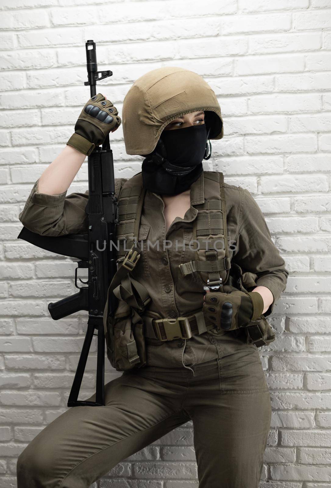 a soldier girl in a helmet is sitting and talking on a mobile phone by Rotozey