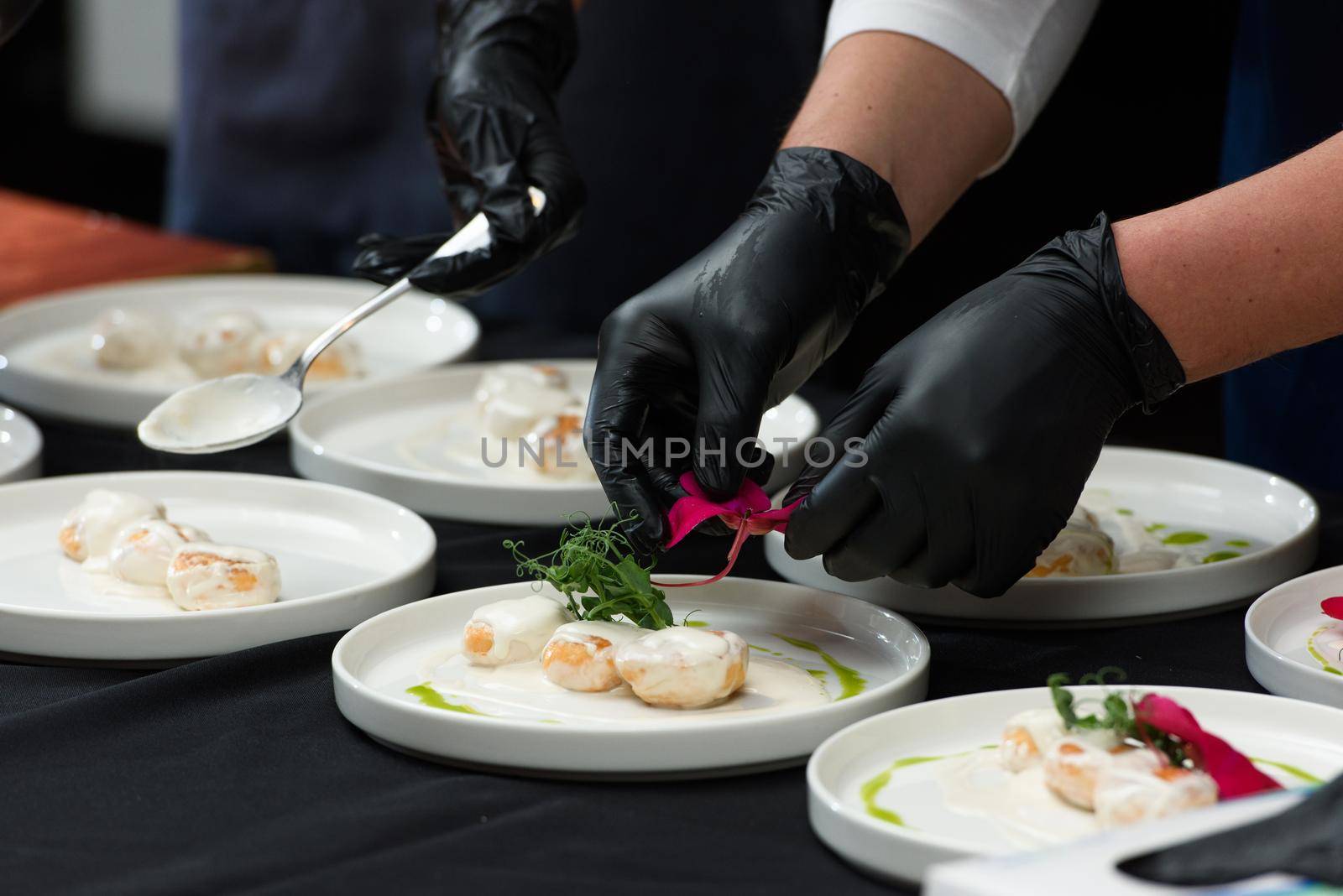 the chef prepares a dish of fish balls in a creamy sauce. irish food