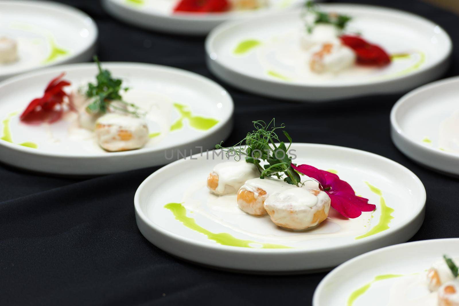 the chef prepares a dish of fish balls in a creamy sauce. irish food