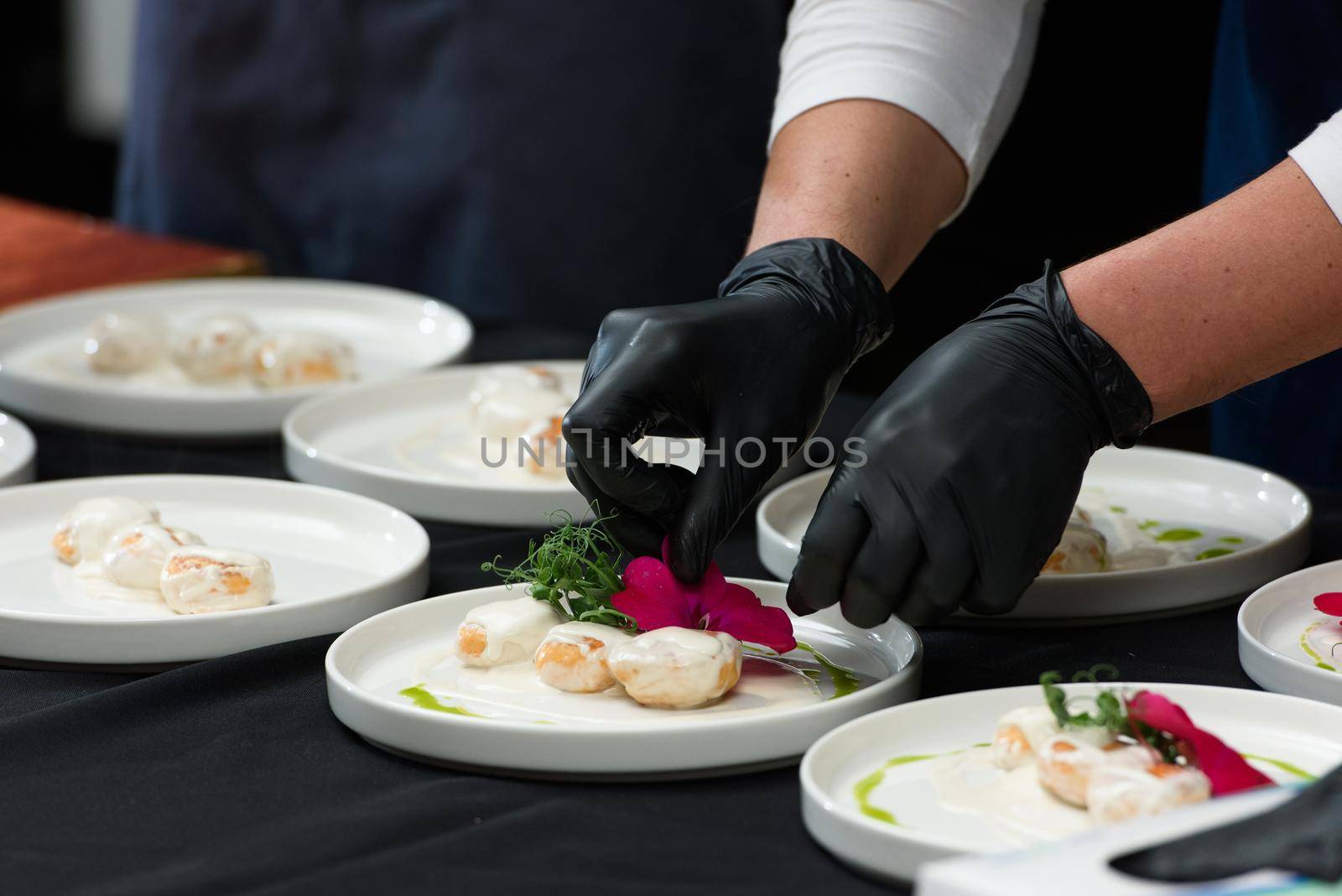 the chef prepares a dish of fish balls in a creamy sauce. irish food